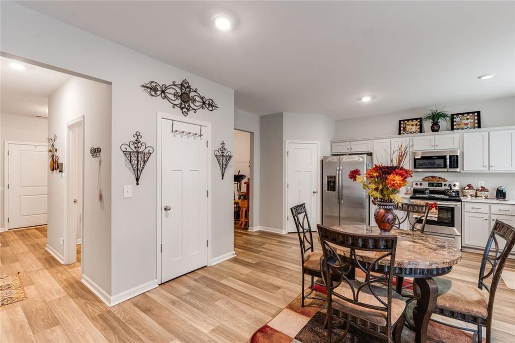 227 Waters Edge Parkway Temple, GA 30179 - Photo 17 of 26 a view of a dining room with furniture and a kitchen