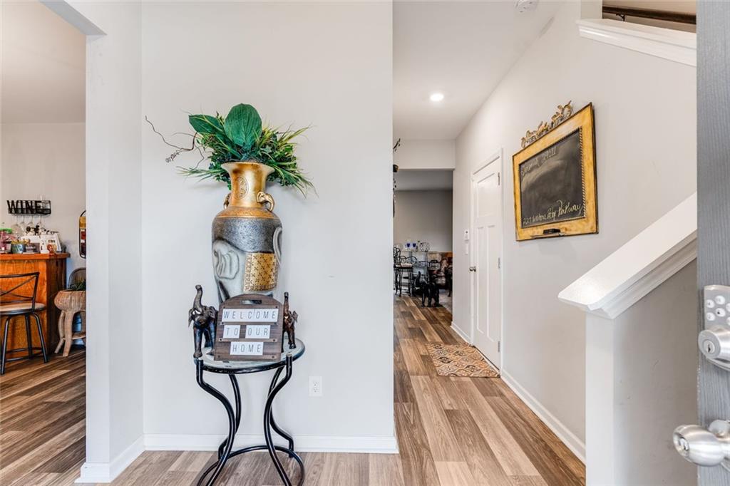 227 Waters Edge Parkway Temple, GA 30179 - Photo 24 of 26 a view of a hallway with furniture and a potted plant