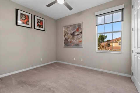 an empty room with windows and closet