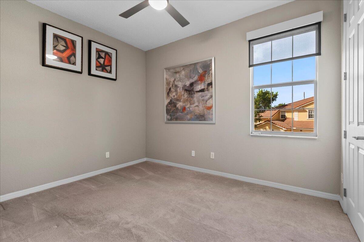 692 Southwest Glen Crest Way Stuart, FL 34997 - Photo 18 of 37 an empty room with windows and closet