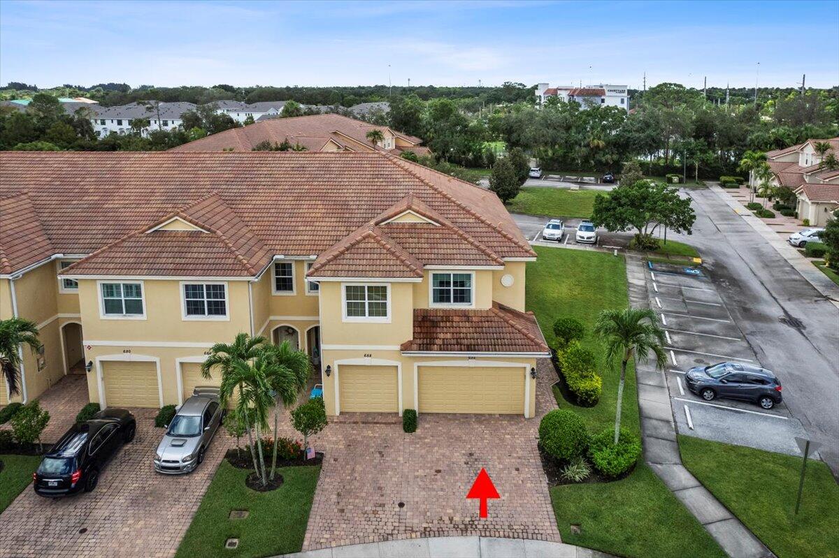 692 Southwest Glen Crest Way Stuart, FL 34997 - Photo 23 of 37 a front view of a house with a yard