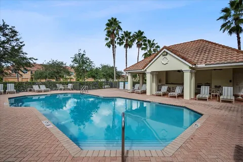 a view of a swimming pool with lounge chair