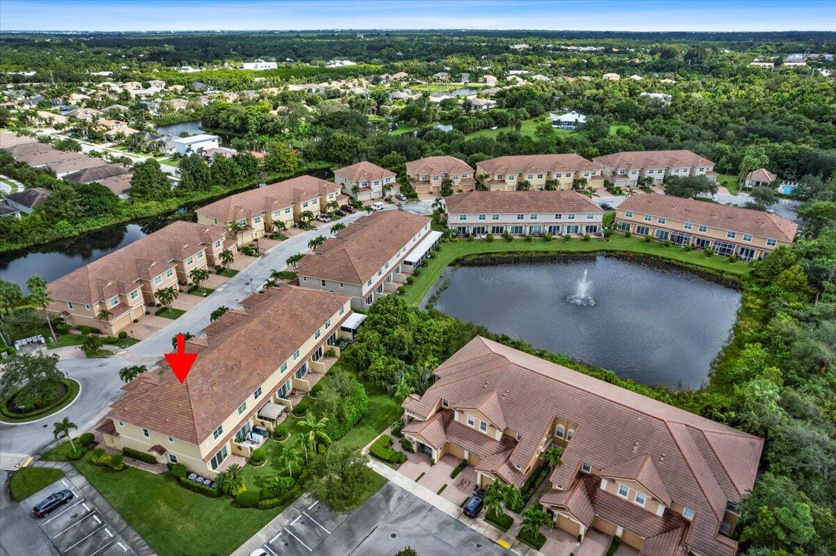 692 Southwest Glen Crest Way Stuart, FL 34997 - Photo 33 of 37 an aerial view of a house with a garden