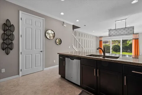 a kitchen with a sink and a window