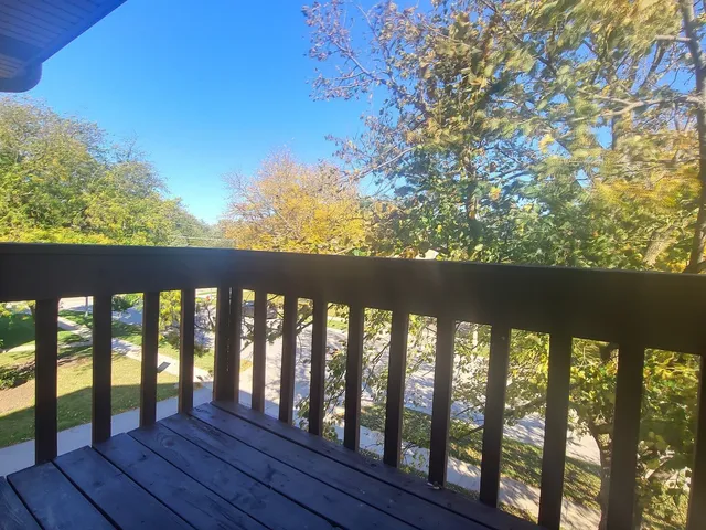 a view of porch with wooden floor