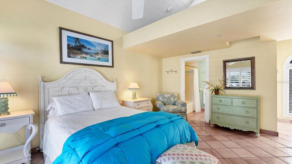 402 Lafitte Street Boca Grande, FL 33921 - Photo 16 of 40 a bedroom with a bed and a table