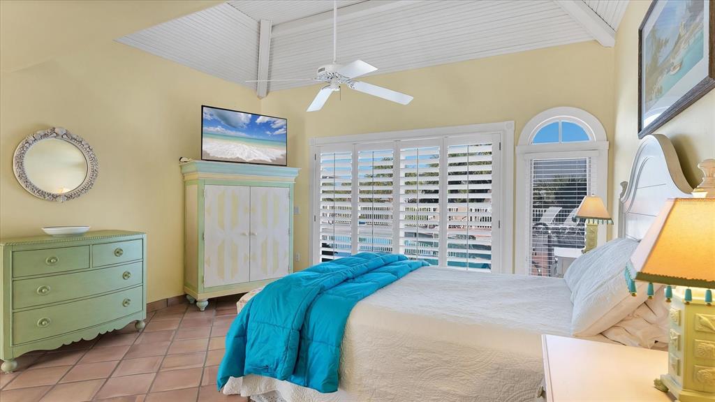 402 Lafitte Street Boca Grande, FL 33921 - Photo 17 of 40 a bedroom with a bed and a dresser