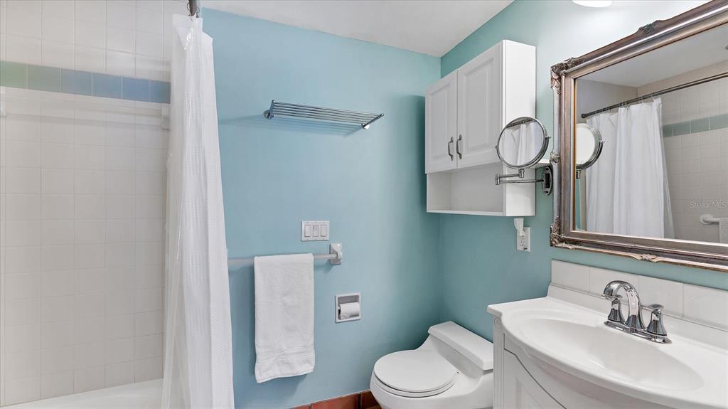 402 Lafitte Street Boca Grande, FL 33921 - Photo 18 of 40 a bathroom with a toilet sink and mirror