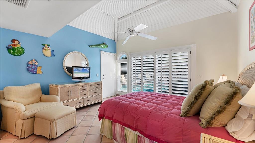 402 Lafitte Street Boca Grande, FL 33921 - Photo 20 of 40 a bedroom with a bed a couch and dresser