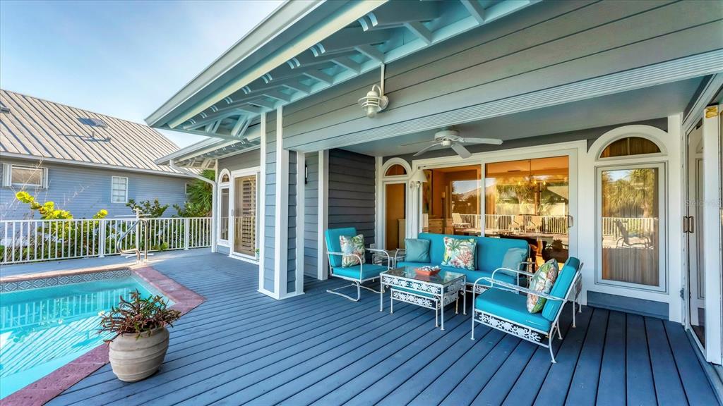 402 Lafitte Street Boca Grande, FL 33921 - Photo 36 of 40 a view of a porch with furniture and garden