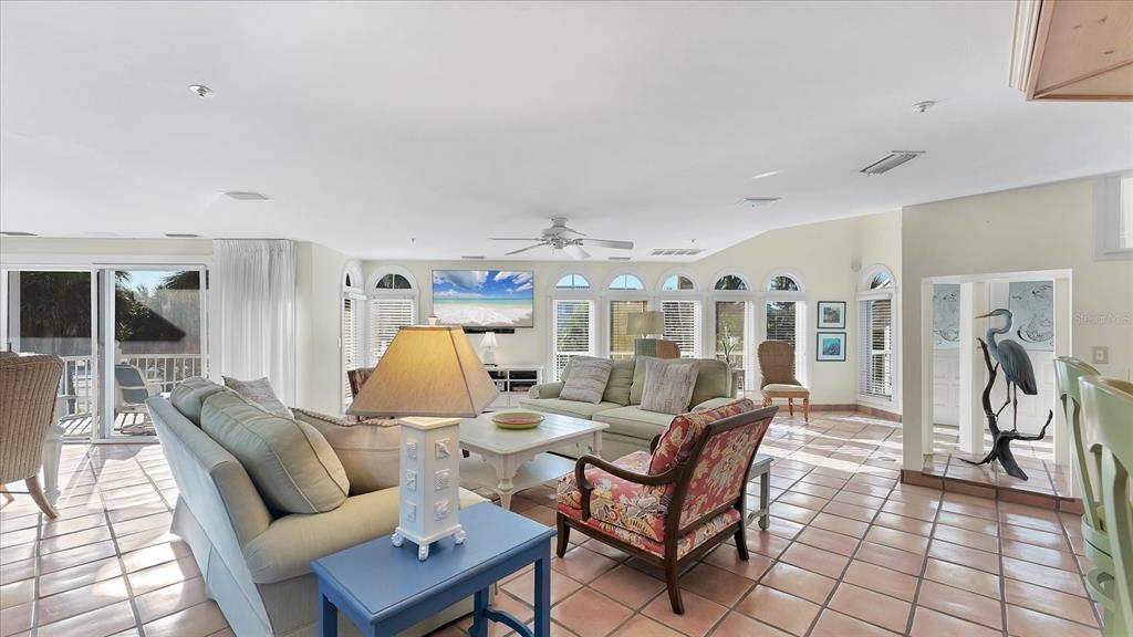 402 Lafitte Street Boca Grande, FL 33921 - Photo 6 of 40 a living room with furniture and a chandelier