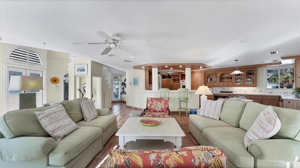 402 Lafitte Street Boca Grande, FL 33921 - Photo 8 of 40 a living room with furniture and a large window