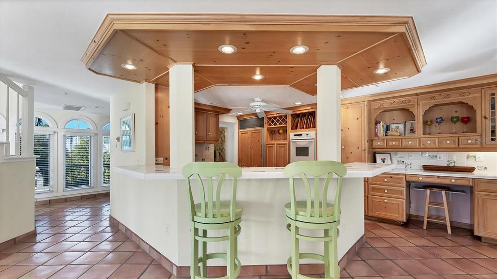 402 Lafitte Street Boca Grande, FL 33921 - Photo 9 of 40 a view of a dining room with furniture and wooden floor