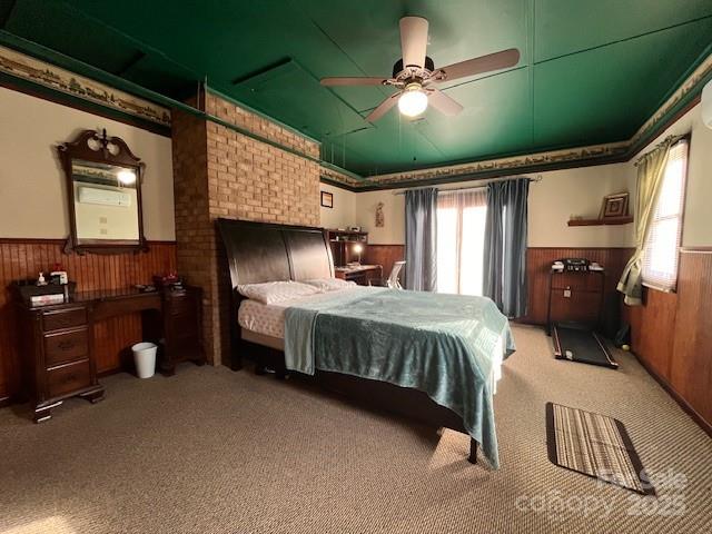 90 Long Street Marion, NC 28752 - Photo 13 of 34 a bedroom with a bed and a chandelier