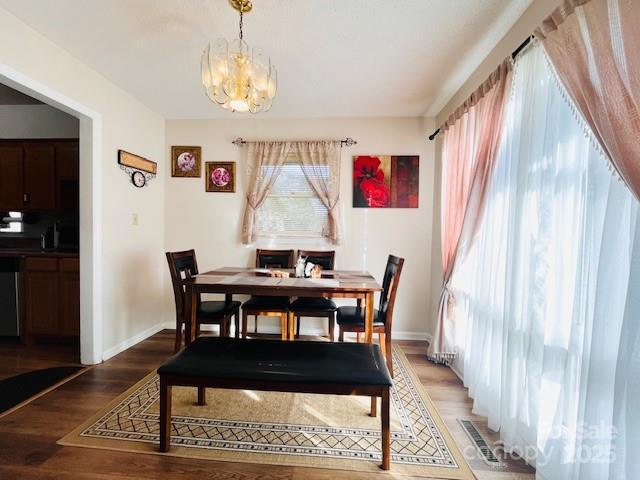 90 Long Street Marion, NC 28752 - Photo 18 of 34 a view of a dining room with furniture and a chandelier