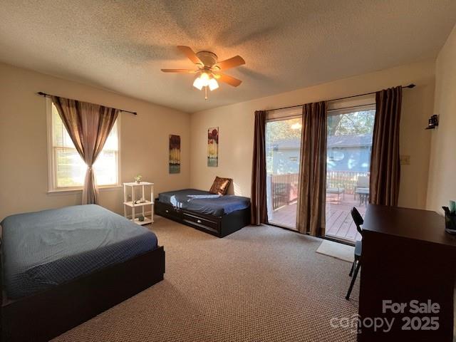 90 Long Street Marion, NC 28752 - Photo 19 of 34 a bedroom with a bed and a chandelier