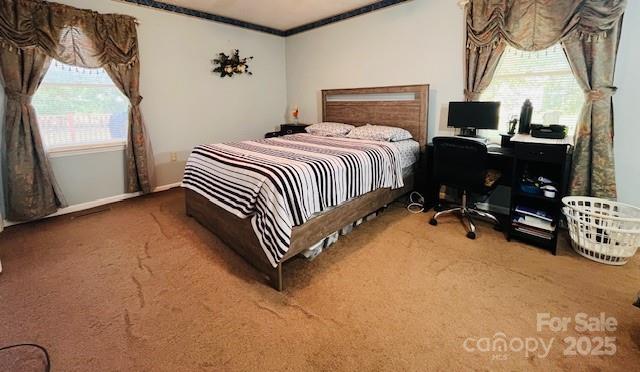90 Long Street Marion, NC 28752 - Photo 24 of 34 a bedroom with a bed and a window