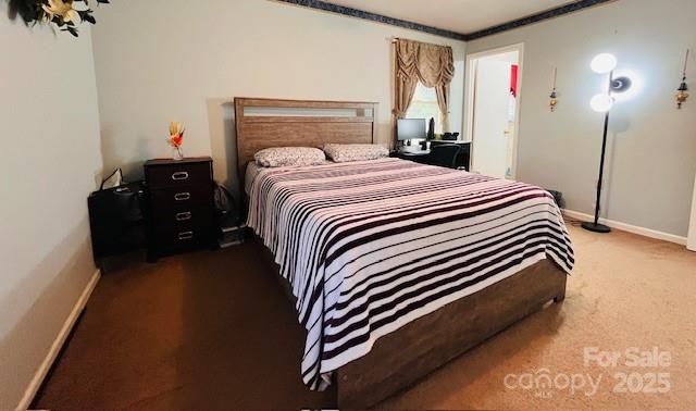 90 Long Street Marion, NC 28752 - Photo 25 of 34 a bedroom with a bed and a night stand