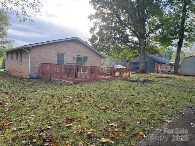 90 Long Street Marion, NC 28752 - Photo 27 of 34 a view of a house with a yard and sitting area