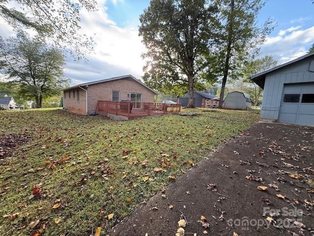 90 Long Street Marion, NC 28752 - Photo 28 of 34 a large tree in front of a house