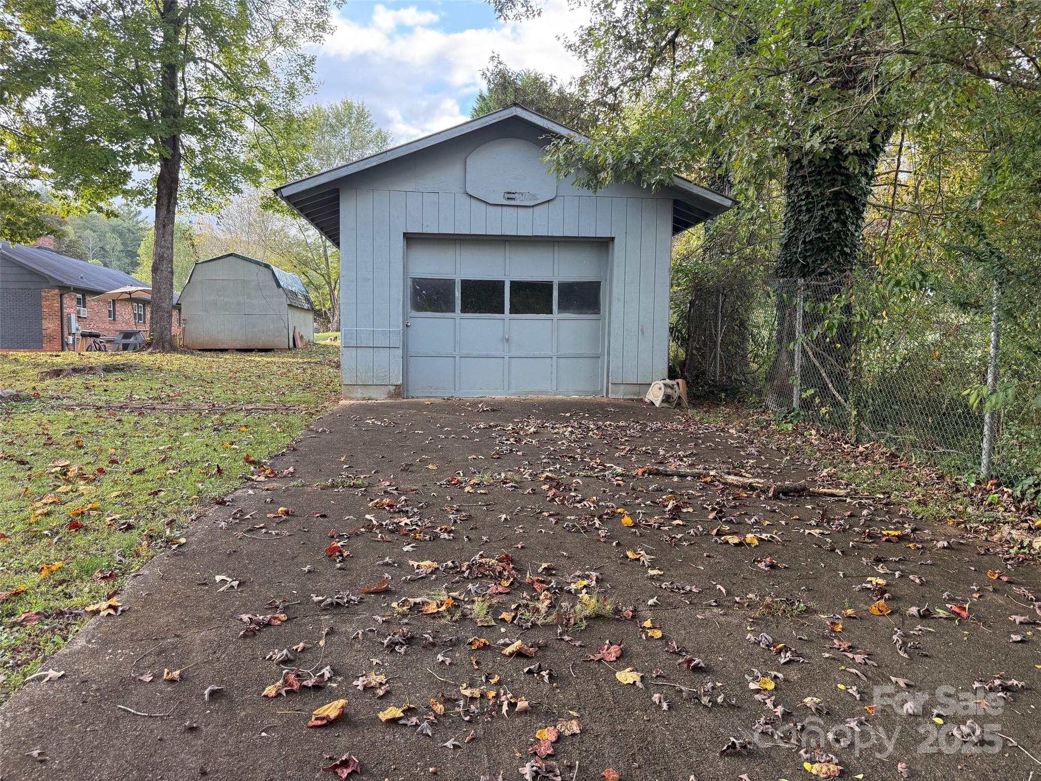 90 Long Street Marion, NC 28752 - Photo 29 of 34 a front view of a house with a yard and garage