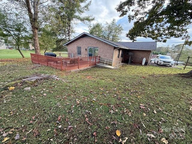 90 Long Street Marion, NC 28752 - Photo 32 of 34 a front view of a house with garden