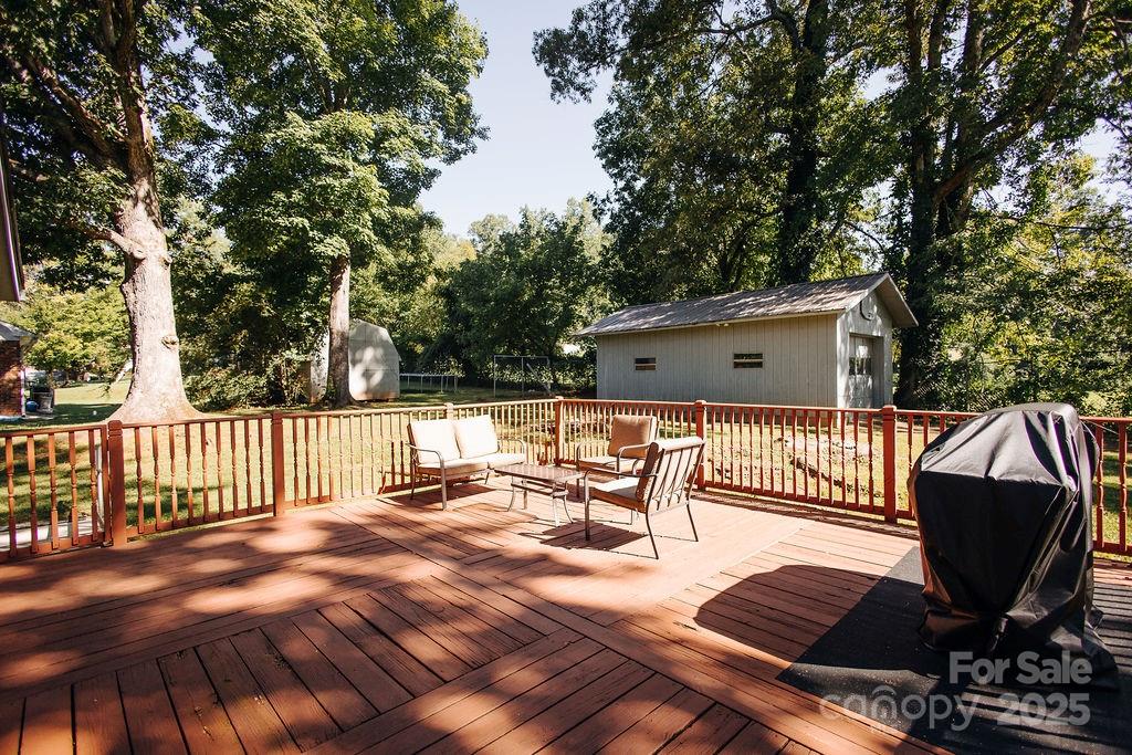 90 Long Street Marion, NC 28752 - Photo 4 of 34 a view of backyard with a patio and outdoor seating