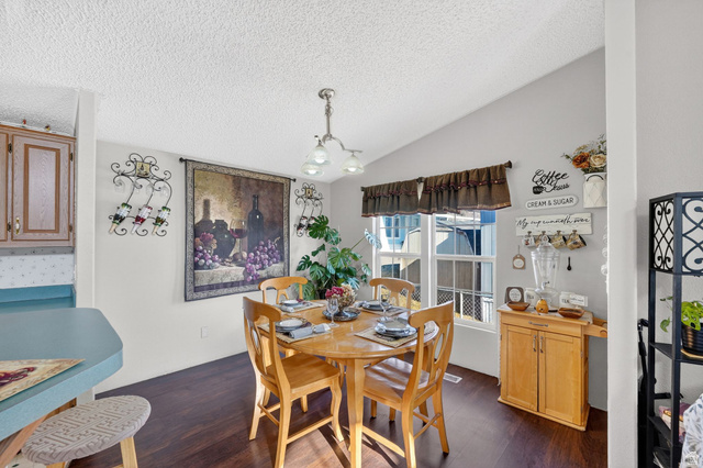 269 Mindella Way, Unit A Layton, UT 84041 - Photo 12 of 37 Dining room with hanging lights and dark wood-type flooring