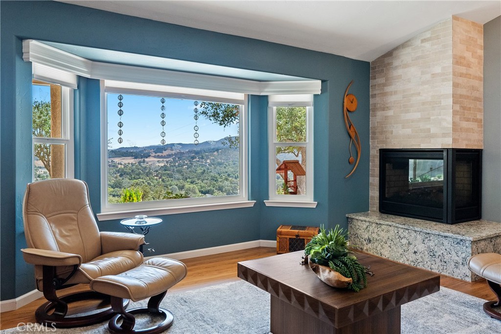 7215 San Gabriel Road Atascadero, CA 93422 - Photo 13 of 74 a living room with furniture and a fireplace