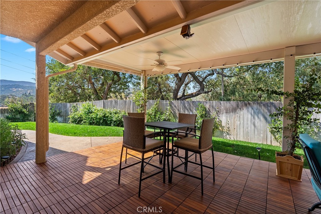 7215 San Gabriel Road Atascadero, CA 93422 - Photo 16 of 74 a patio with glass top table and chairs