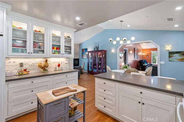a view of a hallway with closet and wooden floor