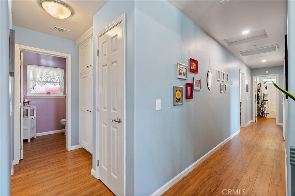 7215 San Gabriel Road Atascadero, CA 93422 - Photo 28 of 74 a view of a hallway with closet and wooden floor