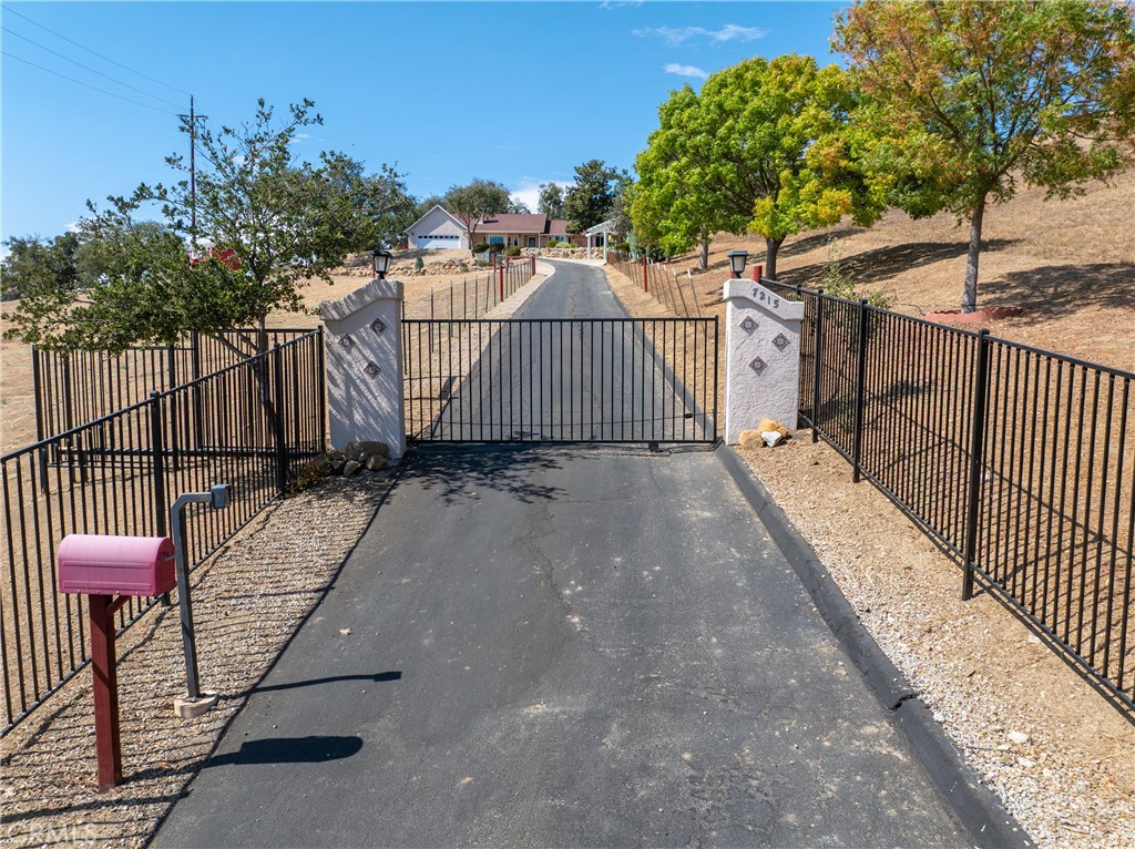 7215 San Gabriel Road Atascadero, CA 93422 - Photo 3 of 74 a view of a wrought iron fences in front of house