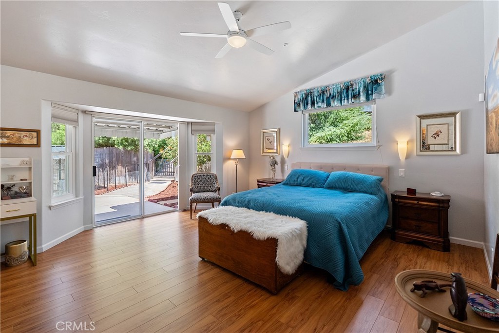 7215 San Gabriel Road Atascadero, CA 93422 - Photo 33 of 74 a bedroom with a bed and wooden floor