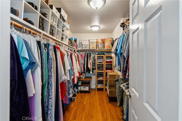 a bedroom with a bed and a desk in it