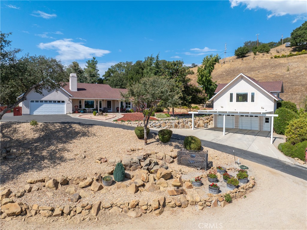 7215 San Gabriel Road Atascadero, CA 93422 - Photo 72 of 74 a view of a house with a yard covered with snow in the background