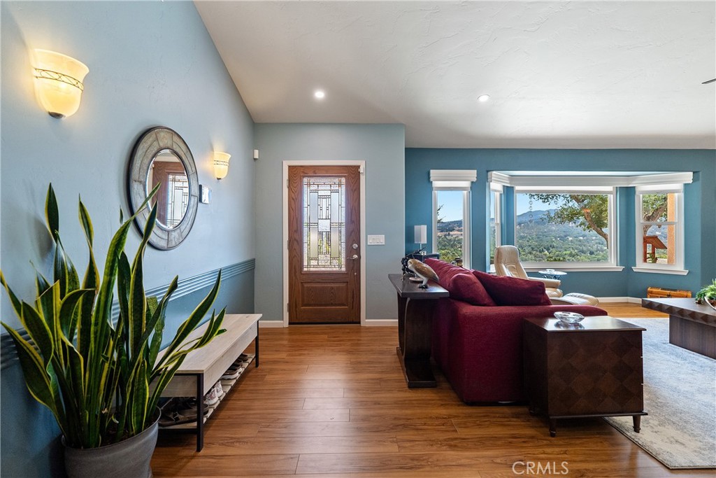 7215 San Gabriel Road Atascadero, CA 93422 - Photo 9 of 74 Stepping inside you are greeted by stylish luxury vinyl plank flooring that flows throughout the home.