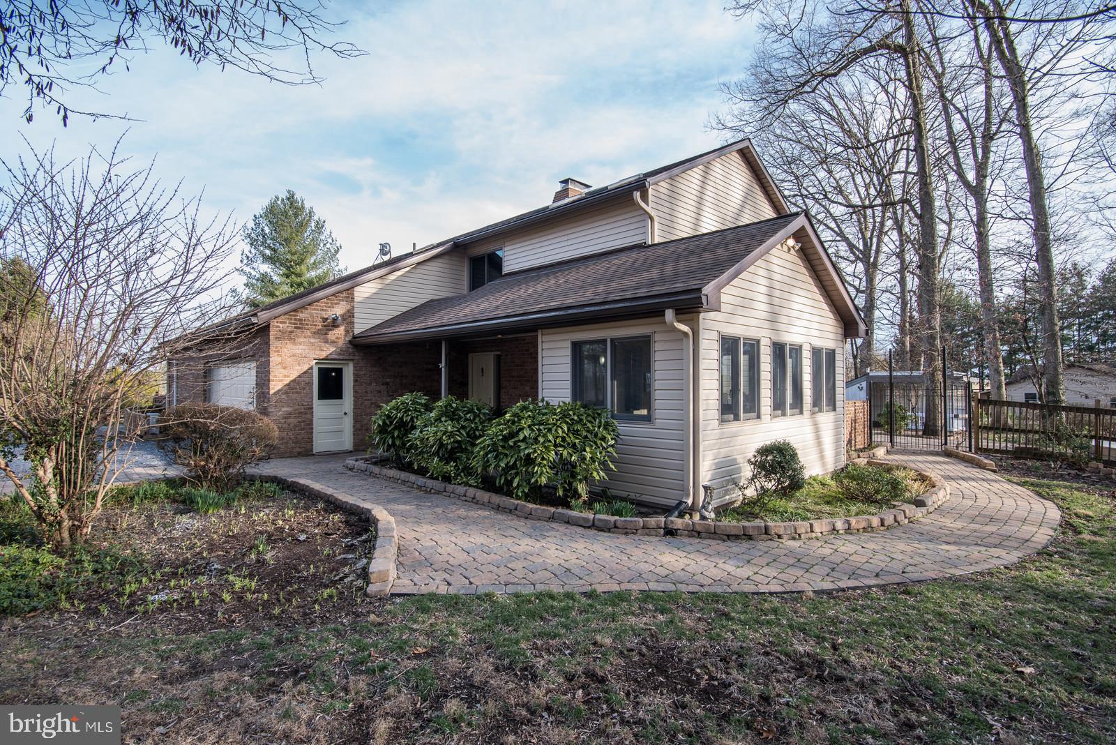 12928 Coppermine Road Union Bridge, MD 21791 - Photo 2 of 38 a front view of a house with a yard