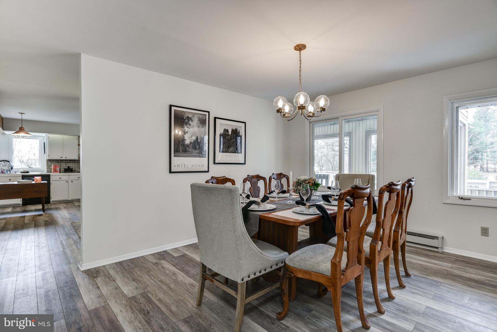 12928 Coppermine Road Union Bridge, MD 21791 - Photo 11 of 38 a view of a dining room with furniture and wooden floor