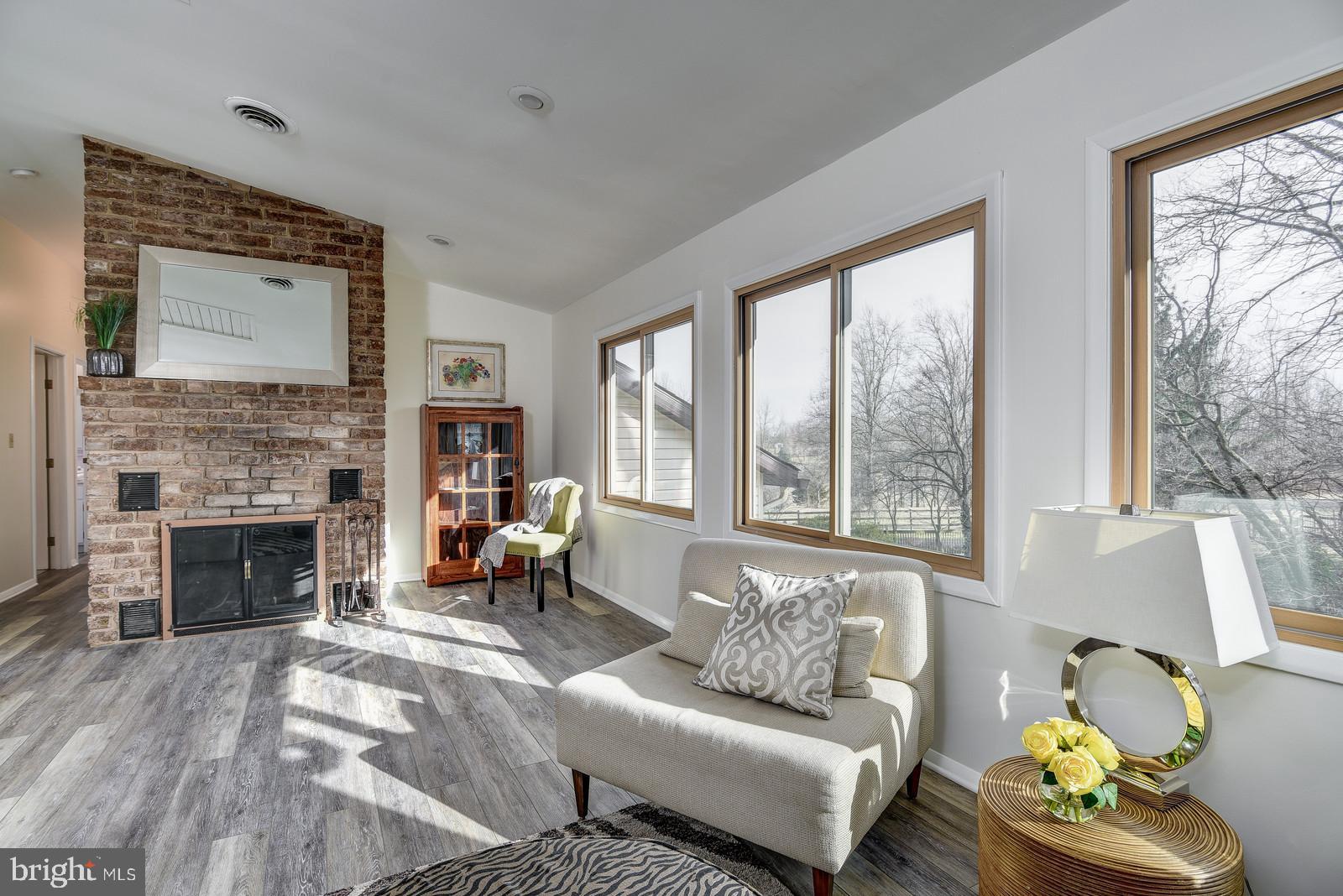 12928 Coppermine Road Union Bridge, MD 21791 - Photo 25 of 38 a living room with furniture and a fireplace
