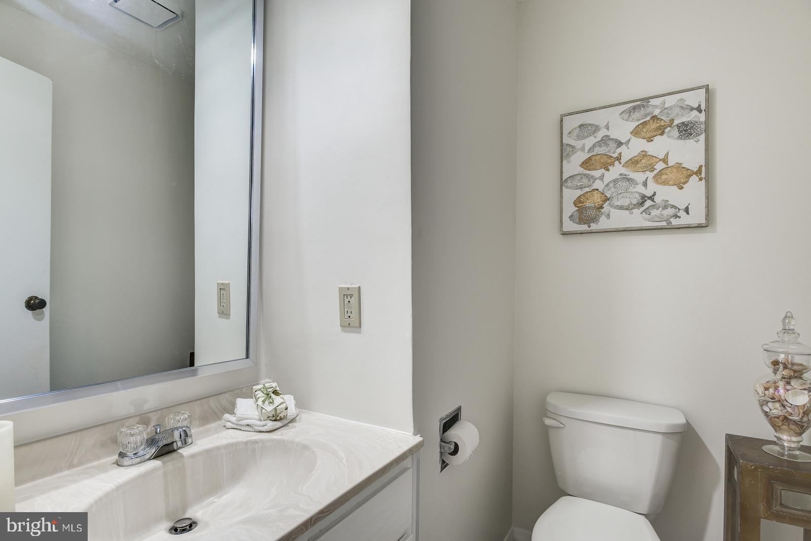 12928 Coppermine Road Union Bridge, MD 21791 - Photo 5 of 38 a bathroom with a sink mirror and toilet