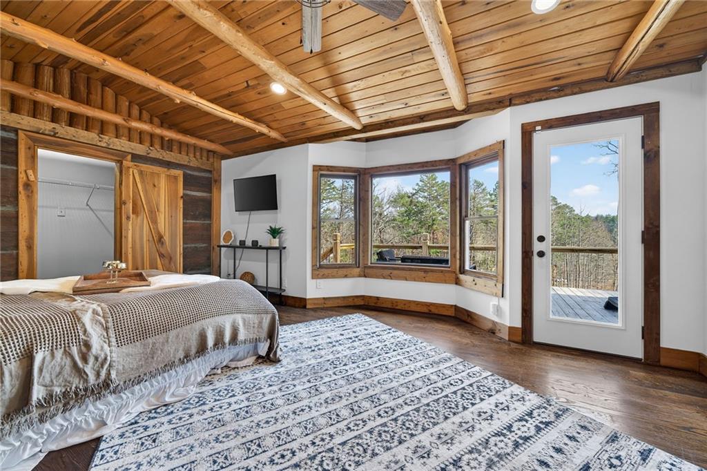 11 Collins Hollow Road Morganton, GA 30560 - Photo 24 of 55 a spacious bedroom with a large bed and a large window