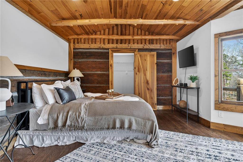 11 Collins Hollow Road Morganton, GA 30560 - Photo 25 of 55 a bedroom with bed and wooden floor
