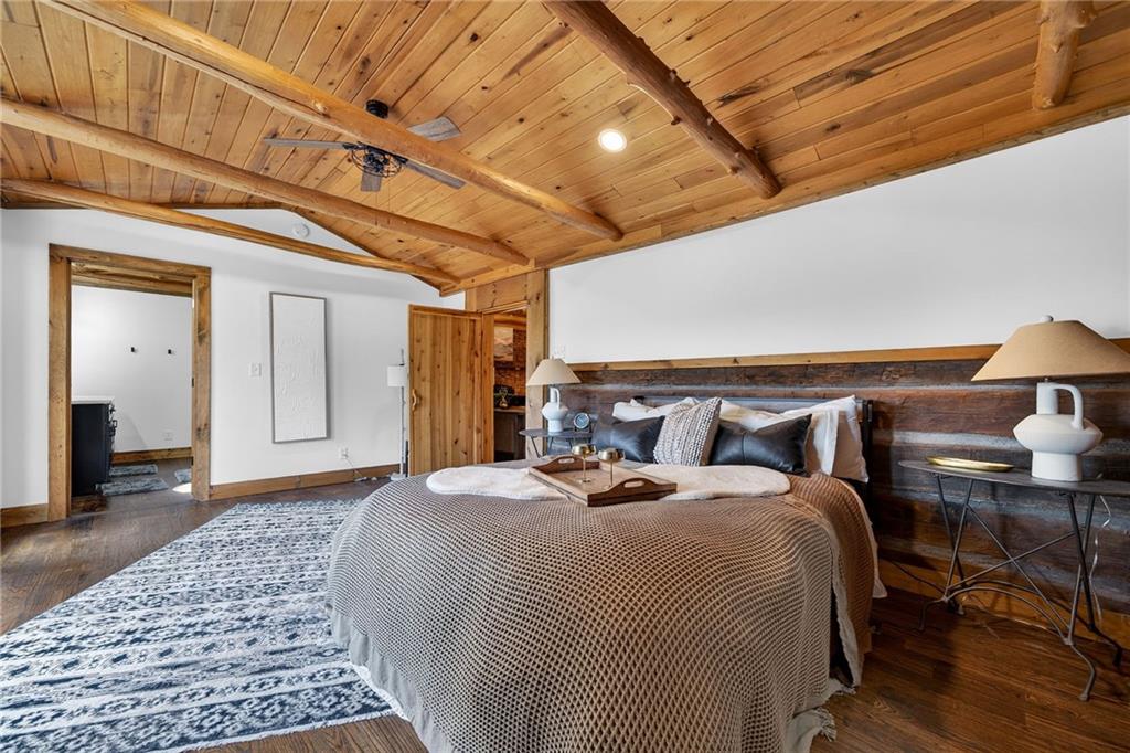 11 Collins Hollow Road Morganton, GA 30560 - Photo 26 of 55 a bed room with a bed and a lamp