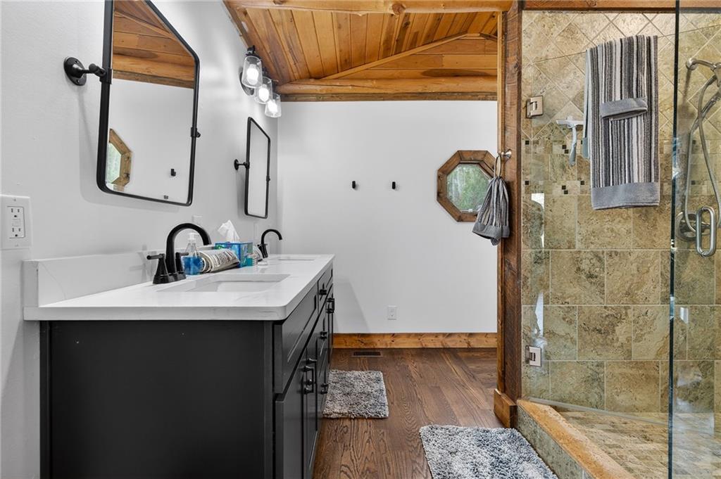 11 Collins Hollow Road Morganton, GA 30560 - Photo 27 of 55 a bathroom with a sink a toilet and shower