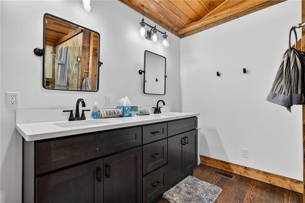 11 Collins Hollow Road Morganton, GA 30560 - Photo 28 of 55 a bathroom with a sink and a mirror