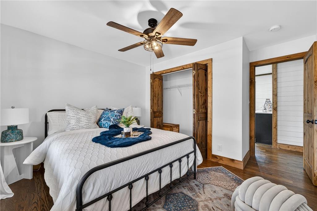 11 Collins Hollow Road Morganton, GA 30560 - Photo 31 of 55 a bedroom with a bed and a chandelier