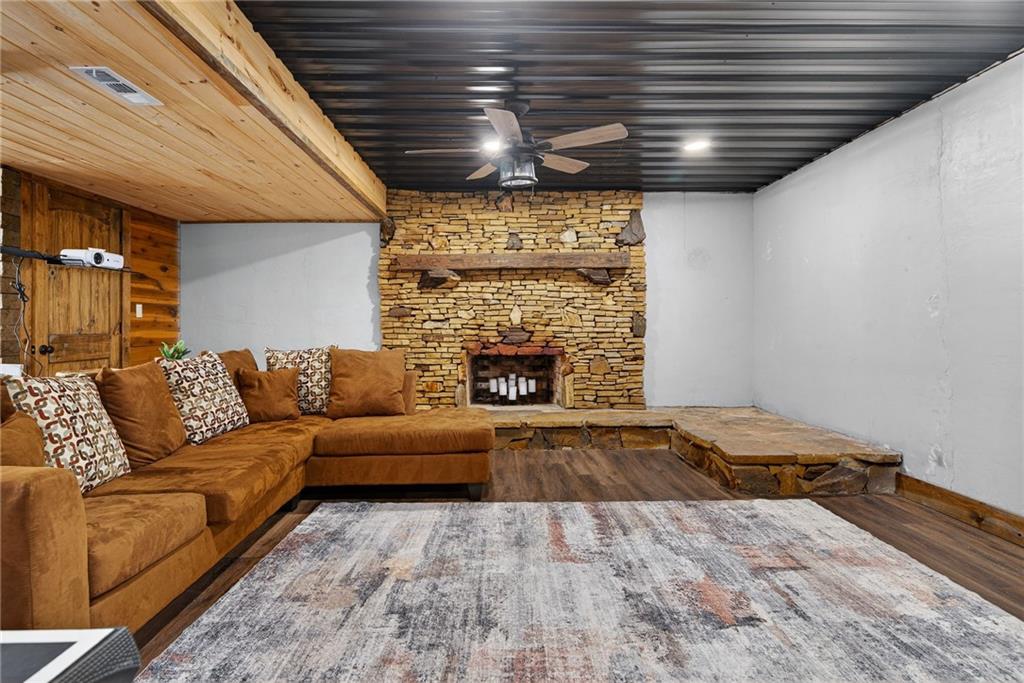 11 Collins Hollow Road Morganton, GA 30560 - Photo 37 of 55 a living room with furniture and a fireplace
