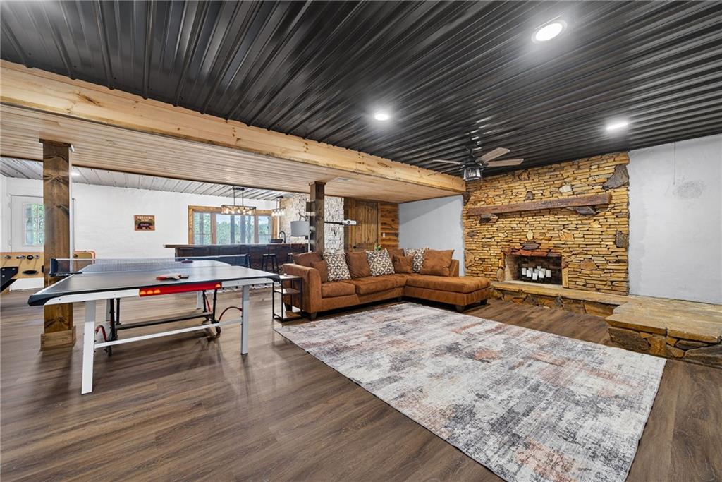 11 Collins Hollow Road Morganton, GA 30560 - Photo 38 of 55 a living room with furniture flat screen tv and a fireplace