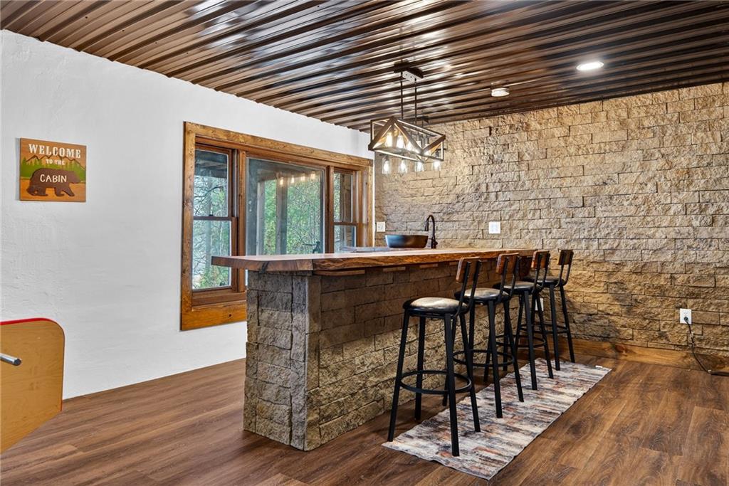 11 Collins Hollow Road Morganton, GA 30560 - Photo 40 of 55 a dining room with furniture and wooden floor